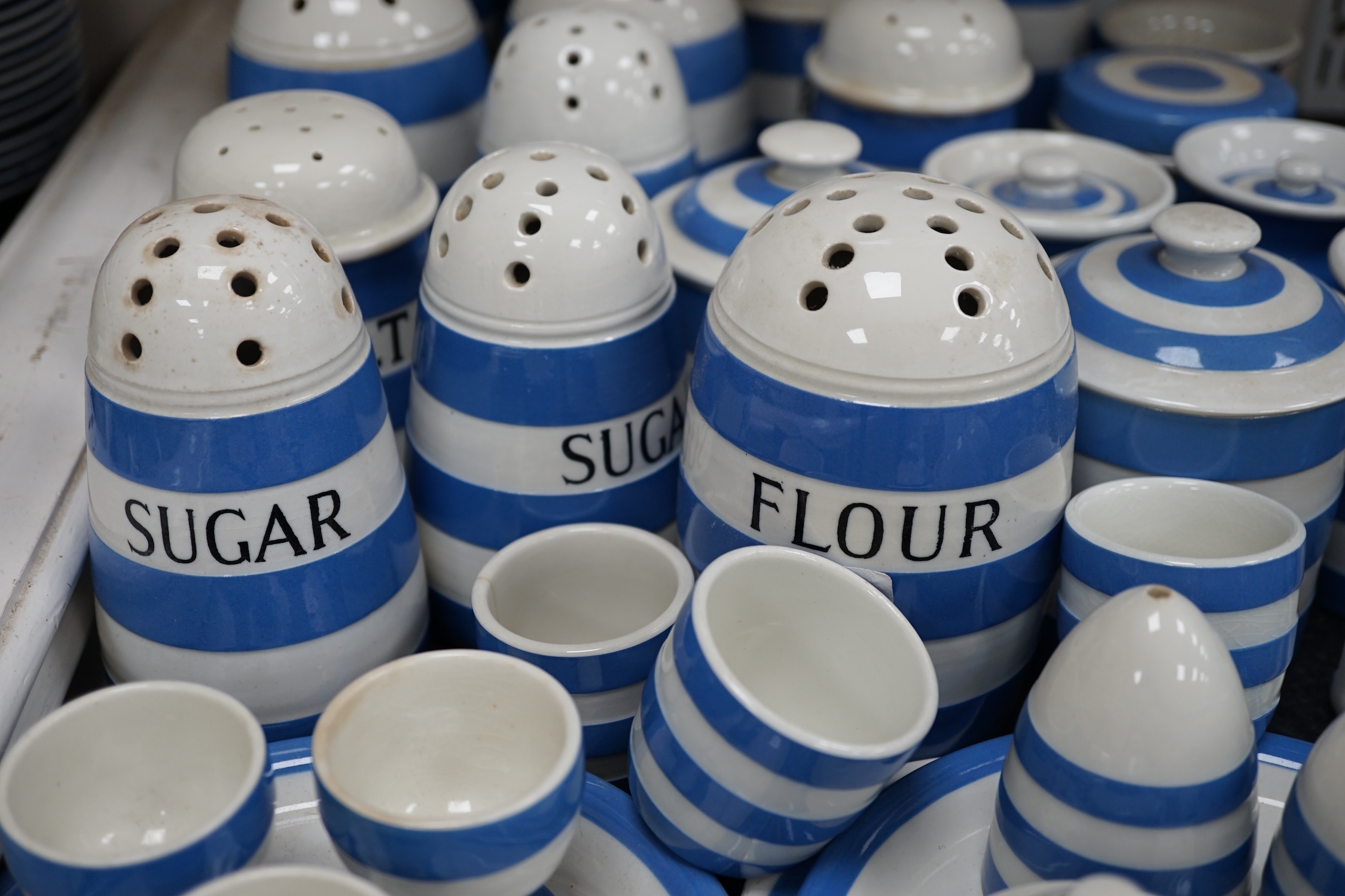 T.G.Green Cornish Kitchenware, a collection to include eleven flour, sugar, salt, brown flour and pepper shakers, six lidded jars, oil and sauce bottles, egg cruet etc, approximately thirty pieces, mixed marks. Condition